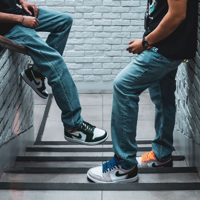 Stylish sneakers showcased on a modern stairway, capturing urban fashion in Kuwait. — Abdullah Alsaibaie, Pexels