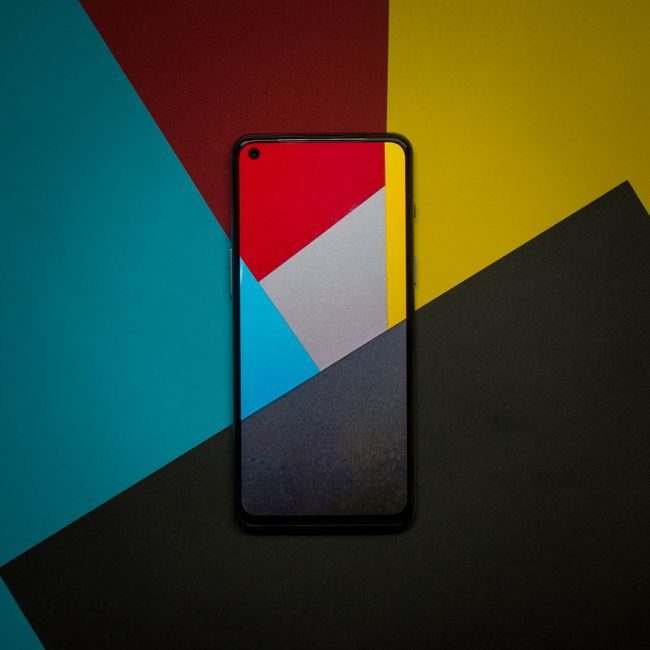 Abstract smartphone display with colorful geometric paper background, capturing modern technology themes. — Atharva Whaval, Pexels