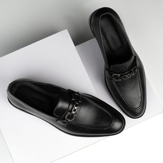 Stylish black leather loafers with chrome detail, perfect for formal occasions. — Danyal Malik, Pexels