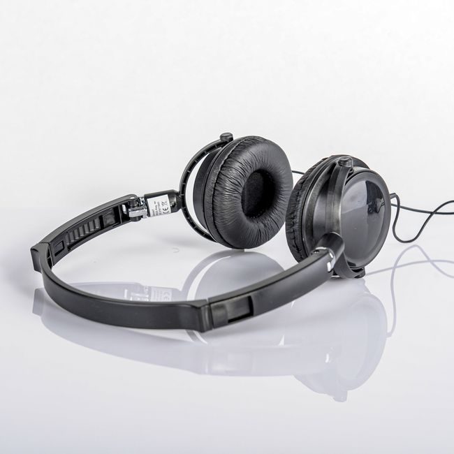 Sleek black headphones with a reflection on a white background. — Saeed Khokhar, Pexels