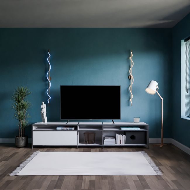 Elegant modern living room interior with a blue accent wall, television, and stylish lighting. — Pușcaș Adryan, Pexels