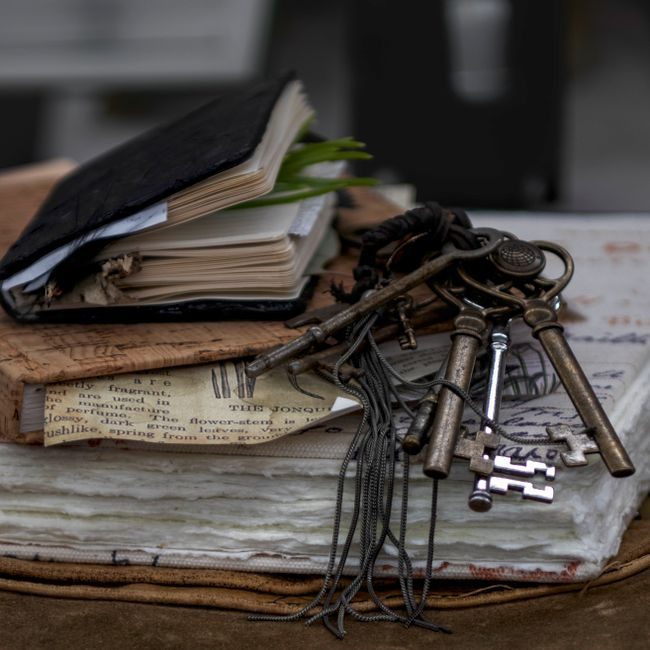 Aesthetic still life of vintage journals and antique keys on layered paper, evoking a sense of history and nostalgia. — Danyale R Zink, Pexels