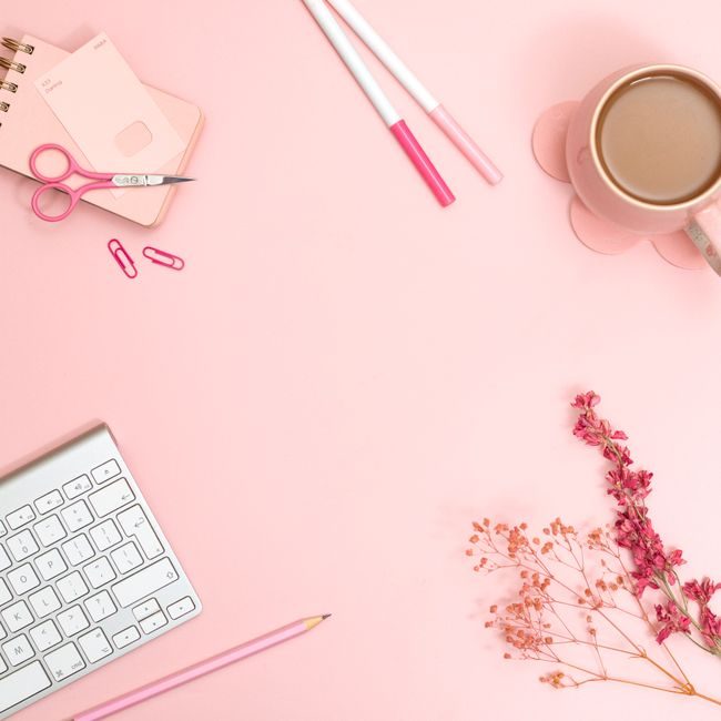 Minimalist pink desk flat lay featuring stationery, keyboard, and coffee for a creative workspace vibe. — Jilly Noble, Pexels