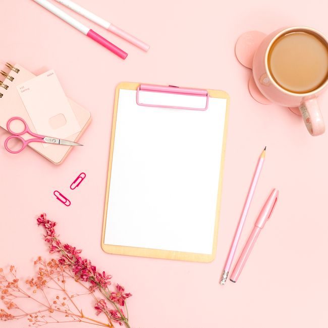 Minimalist flat lay of pink office supplies featuring a clipboard, stationery, and coffee cup. — Jilly Noble, Pexels
