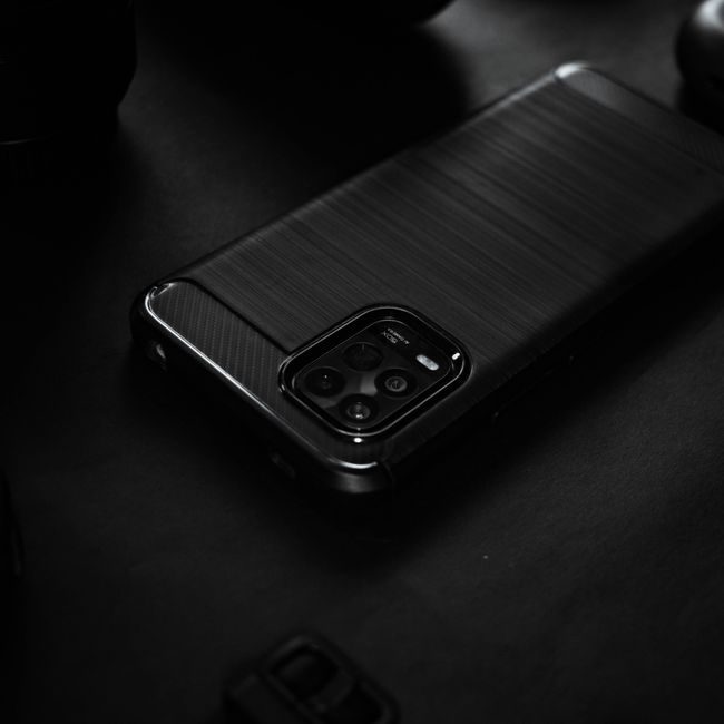 Close-up of a sleek black smartphone on a dark surface, highlighting elegant design. — Carlos Jairo, Pexels