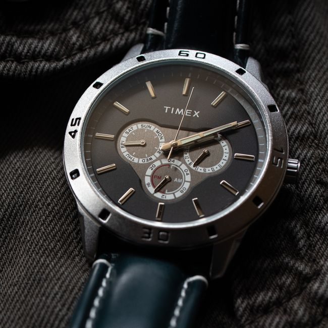 Close-up photo of a Timex chronograph wristwatch on fabric background. — Hemanth K M, Pexels