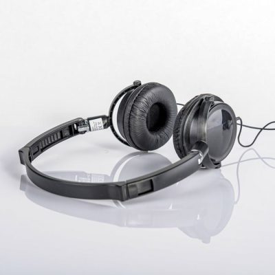 Sleek black headphones with a reflection on a white background. — Saeed Khokhar, Pexels