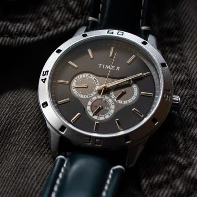Close-up photo of a Timex chronograph wristwatch on fabric background. — Hemanth K M, Pexels