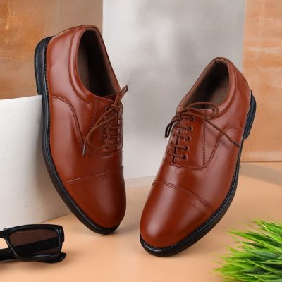 Elegant tan leather shoes paired with sunglasses, perfect for modern fashion enthusiasts. — ALOK DAS, Pexels