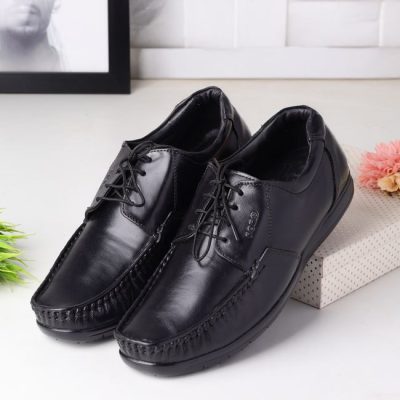 Sleek black leather men's shoes displayed on a decorative box, perfect for formal occasions. — ALOK DAS, Pexels